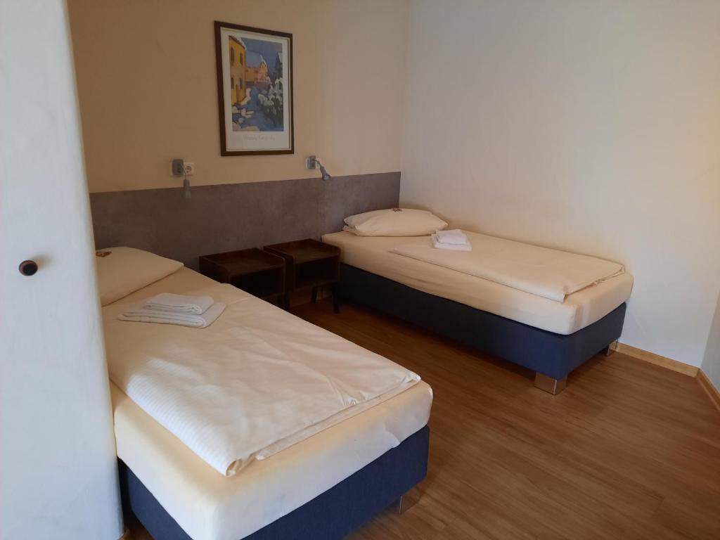 Postel nebo postele na pokoji v ubytování Gasthaus Post