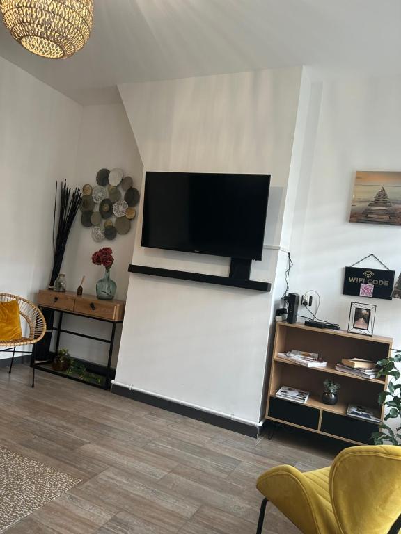 Televízia a/alebo spoločenská miestnosť v ubytovaní La Maison de la Côte