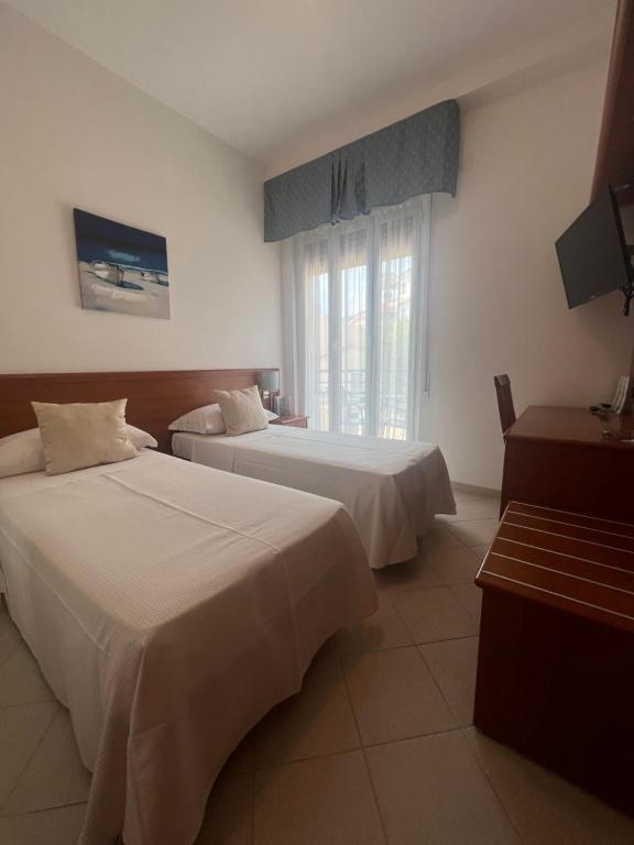 Кровать или кровати в номере Hotel Noris