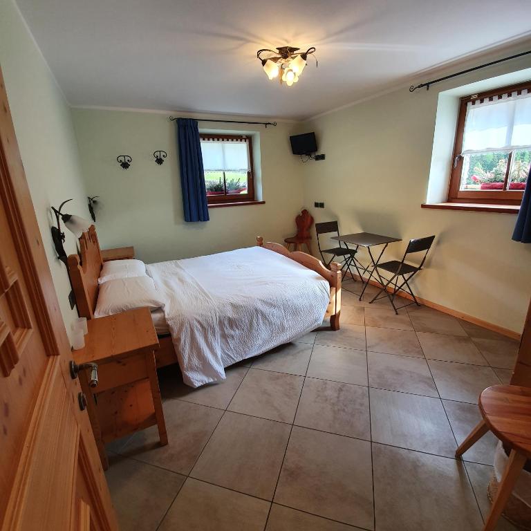 Postel nebo postele na pokoji v ubytování Hotel Chalet val di Rabbi