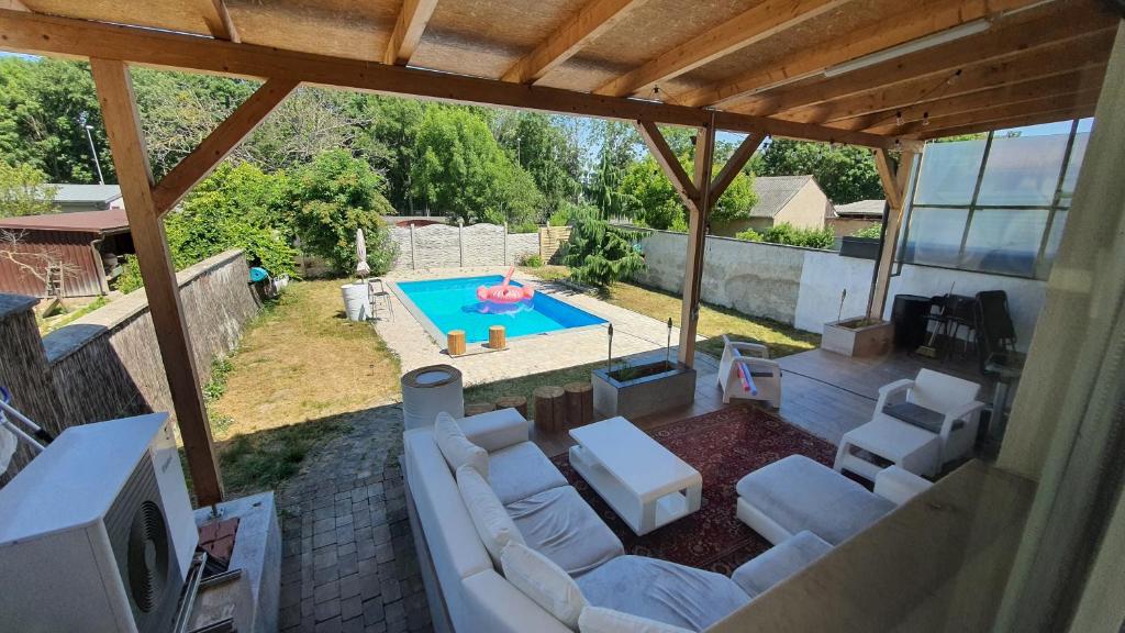 an overhead view of a living room with a pool at 4 room flat with garden and pool in Kittsee