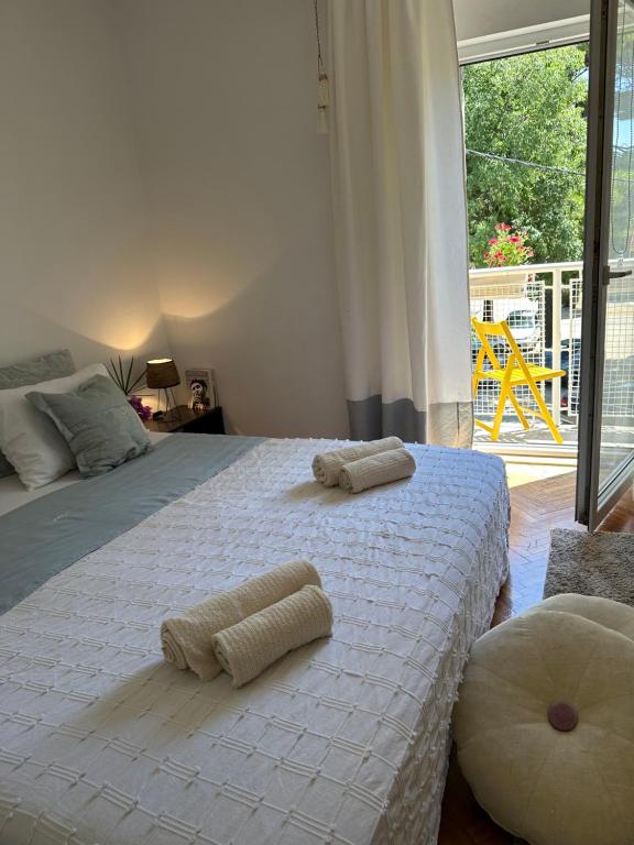 a bedroom with two beds with towels on them at Cosy Family Apartment Marina Kastela near Airport in Kaštela