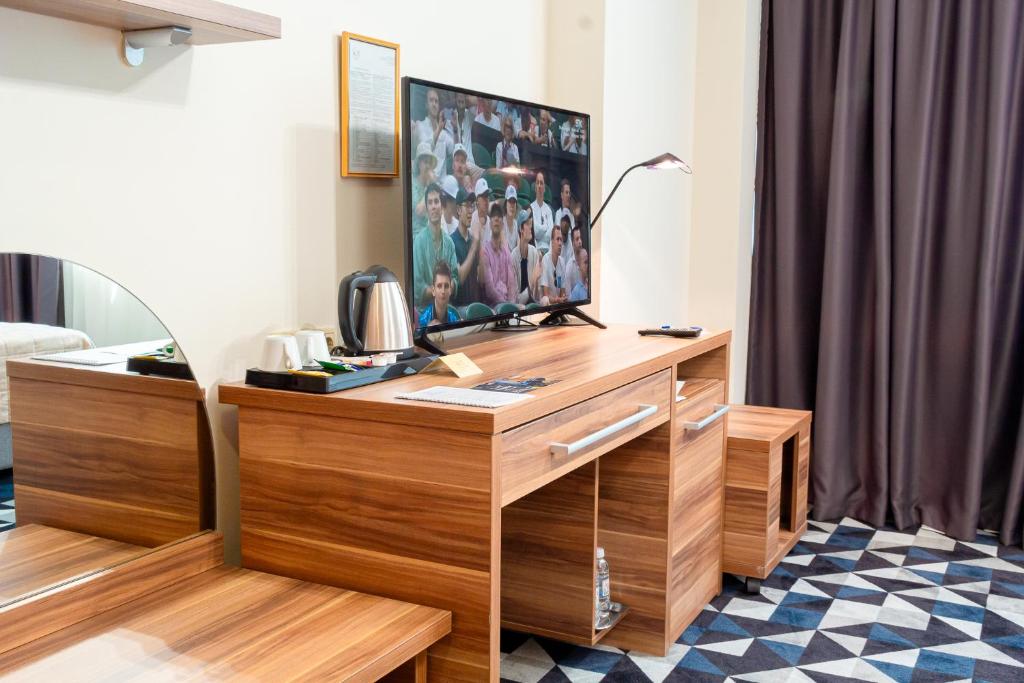 TV a/nebo společenská místnost v ubytování Hotel Art