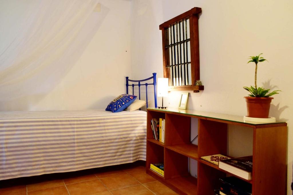 Postel nebo postele na pokoji v ubytování El Aljibe Suite Rural