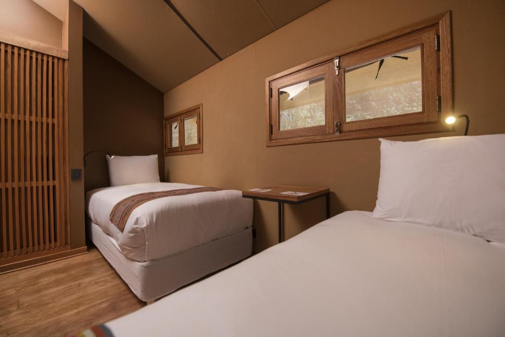 Postel nebo postele na pokoji v ubytování Las Qolqas EcoResort Ollantaytambo