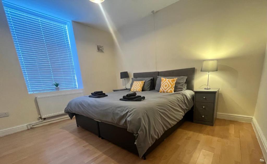 a bedroom with a large bed and a window at Spacious ground floor suite comfortably sleeps up to eight in Halifax