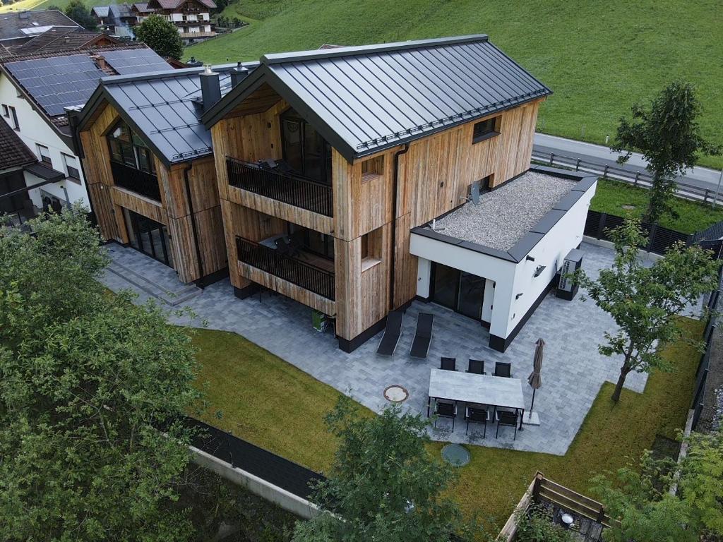 an aerial view of a large wooden building with a kitchen at Haus Alpenfan in Grossarl