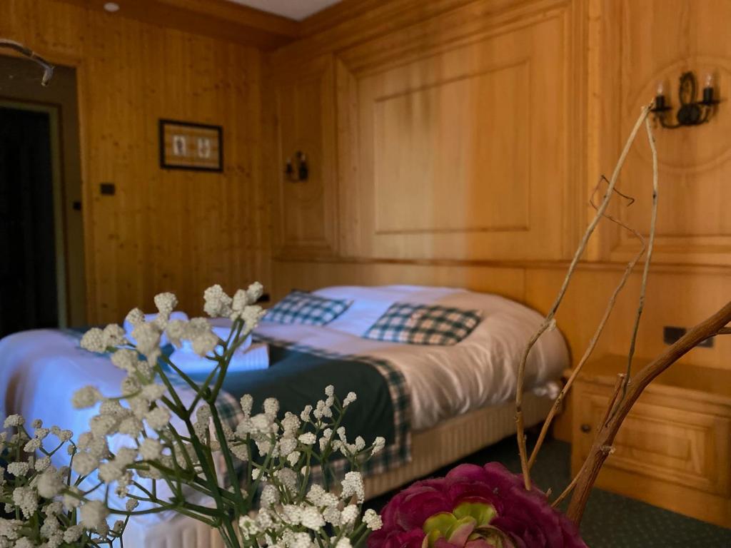 Postel nebo postele na pokoji v ubytování Le Rosenmeer - Hotel Restaurant, au coeur de la route des vins d'Alsace