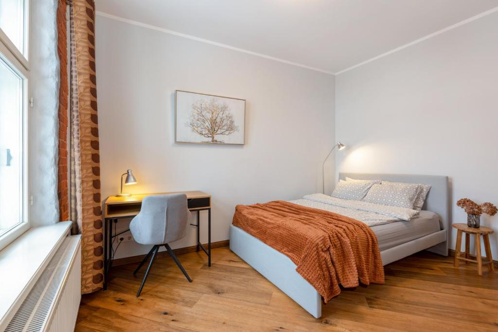 Postel nebo postele na pokoji v ubytování Rüütli Apartments in Tartu Old Town