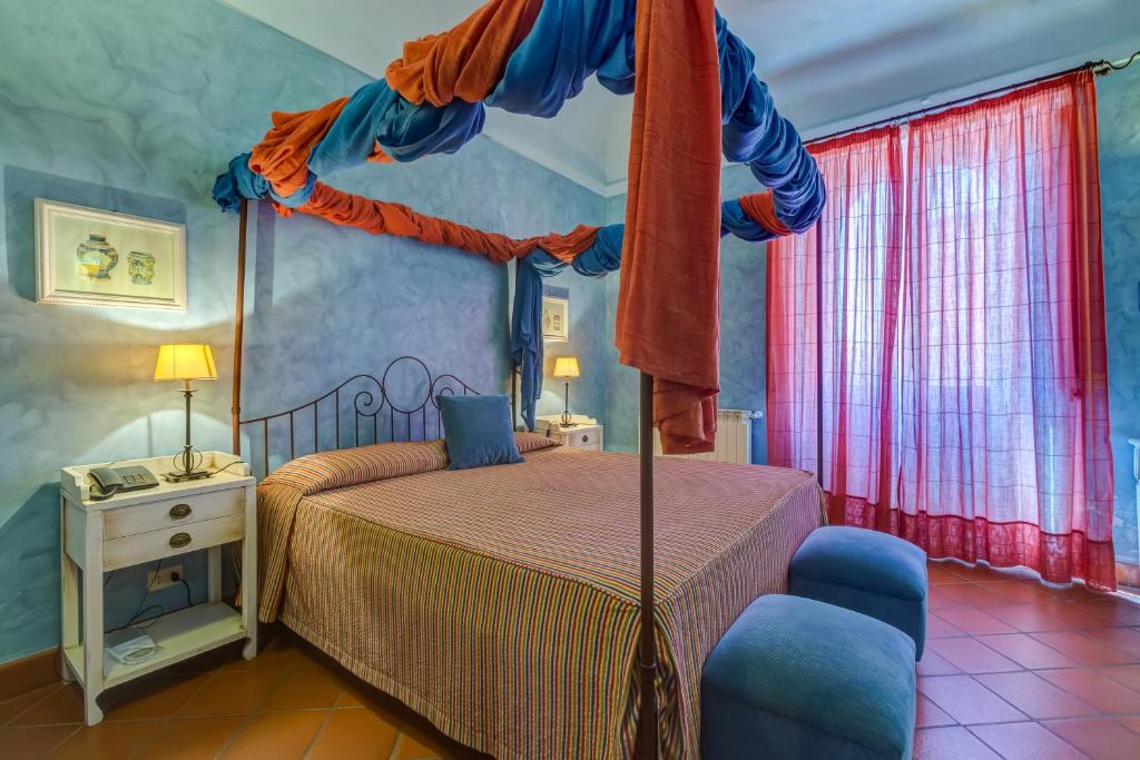 Postel nebo postele na pokoji v ubytování La Casa delle Monache Country Resort