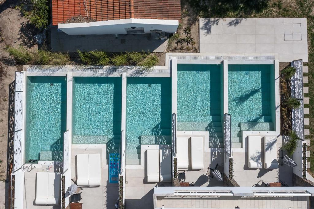 an overhead view of a swimming pool at Anemone Premium Suites Faliraki in Faliraki