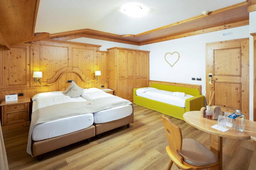 Postel nebo postele na pokoji v ubytování Hotel Galli