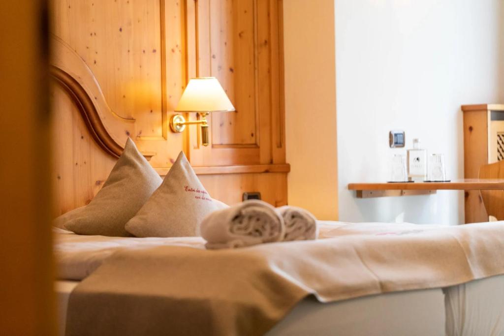 Postel nebo postele na pokoji v ubytování Hotel Galli
