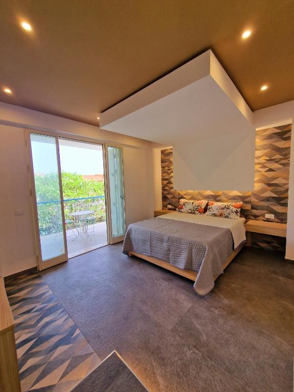 Postel nebo postele na pokoji v ubytování Mongibello Palace B&B