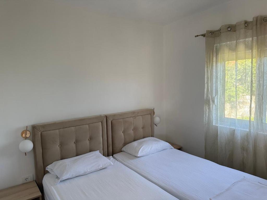 Postel nebo postele na pokoji v ubytování Niki Apartments