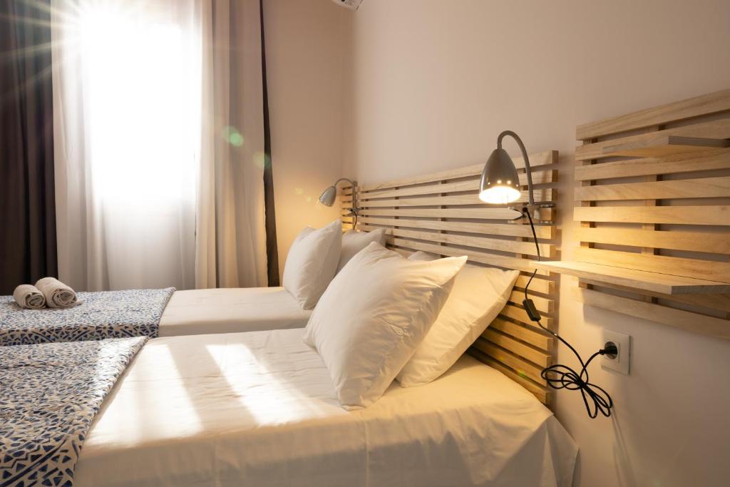 Postel nebo postele na pokoji v ubytování Villa Ruby Pessada
