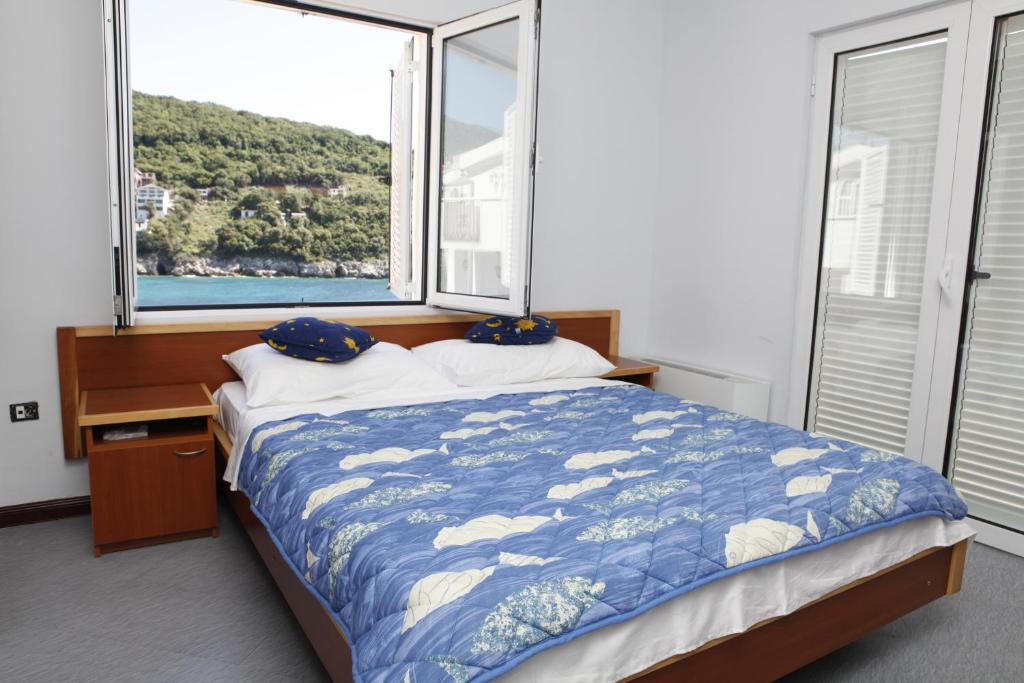 Postel nebo postele na pokoji v ubytování Hotel R
