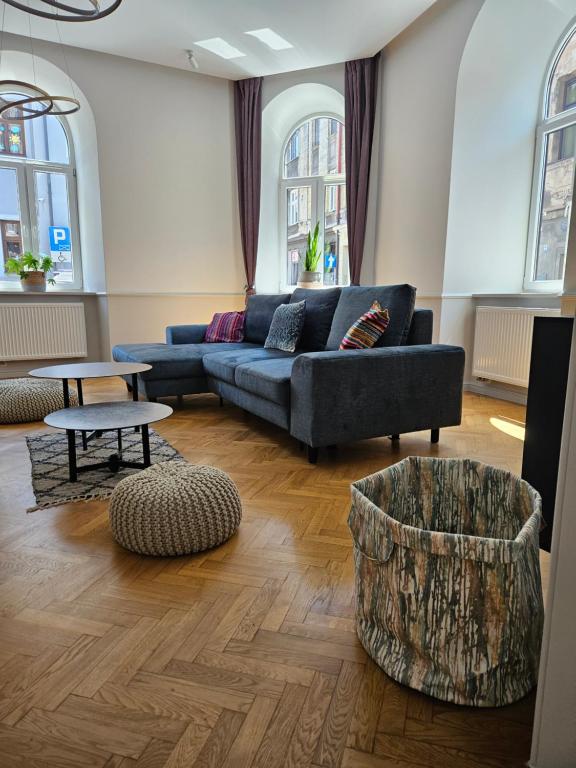 a living room with a couch and a table at Apartament Sejmowa in Cieszyn