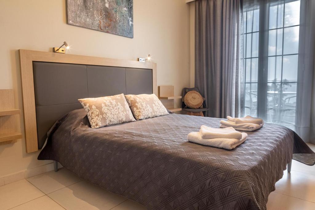 Postel nebo postele na pokoji v ubytování ANGELO Cafe Hotel