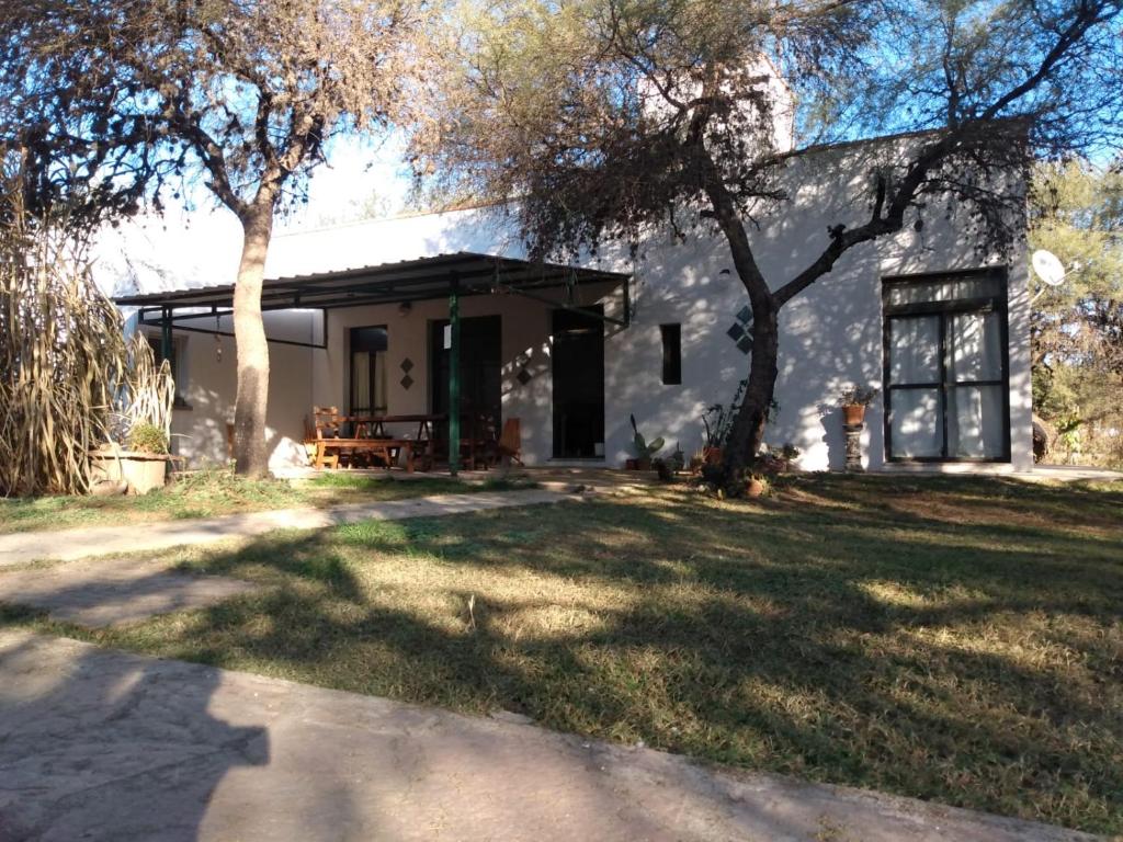 a house with a tree in front of it at Indigo in Carpintería