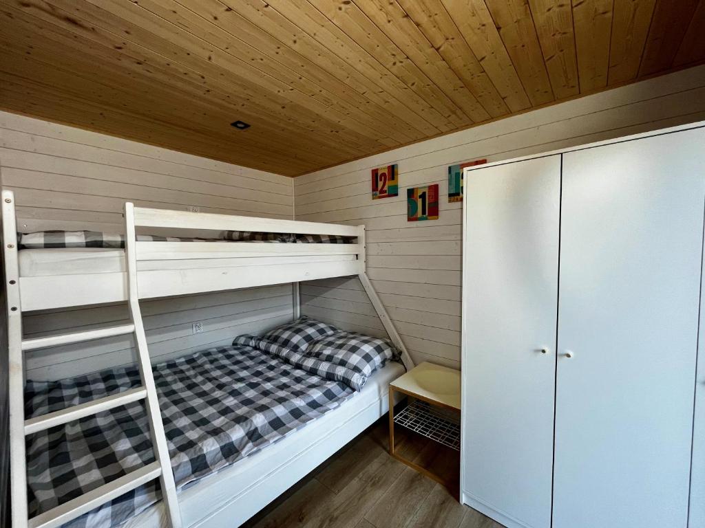 Postel nebo postele na pokoji v ubytování Domki Baltyk