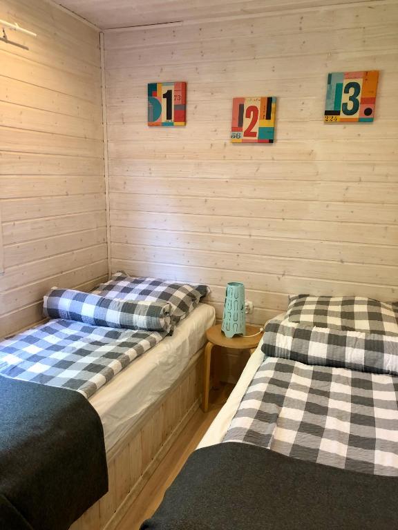 Postel nebo postele na pokoji v ubytování Domki Baltyk