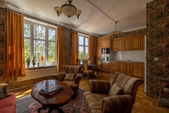 a living room with a couch and a table at Kläckeberga Bed Not Breakfast in Kalmar