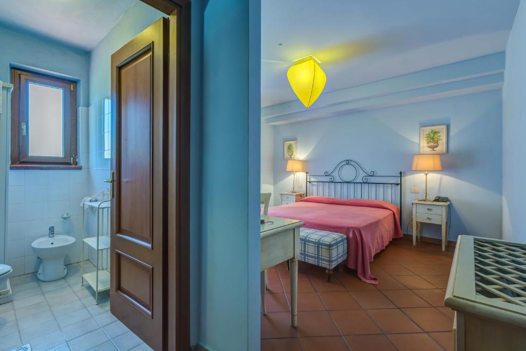 Postel nebo postele na pokoji v ubytování La Casa delle Monache Country Resort