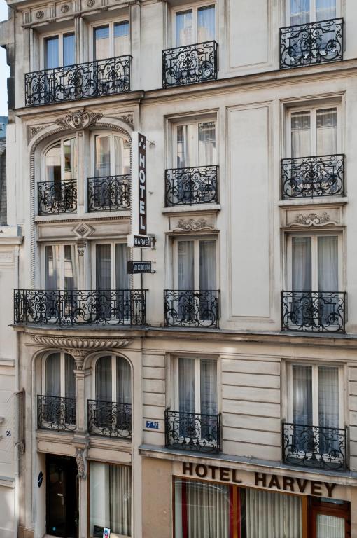 a building with balconies on the side of it at Hôtel Harvey in Paris