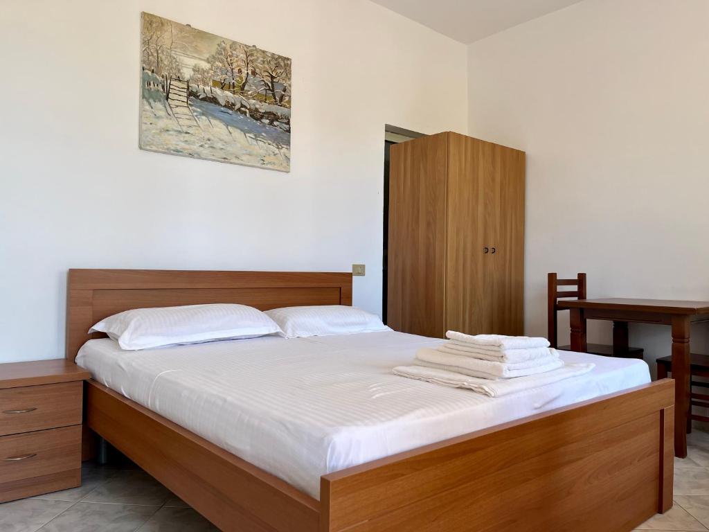 Postel nebo postele na pokoji v ubytování Rei’s place