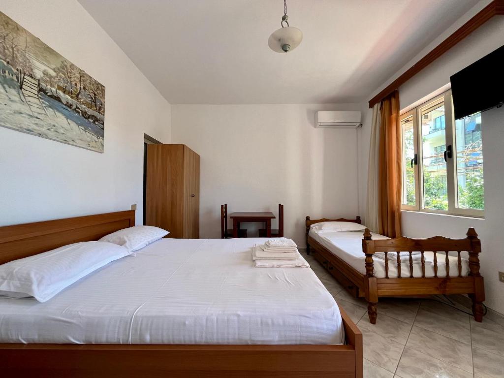 Postel nebo postele na pokoji v ubytování Rei’s place