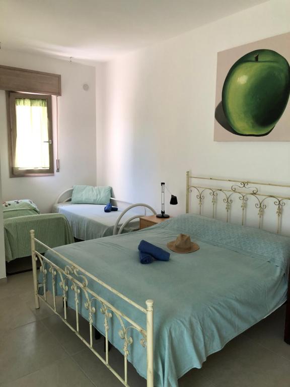 A bed or beds in a room at Villa Enza - A 150 passi dal mare