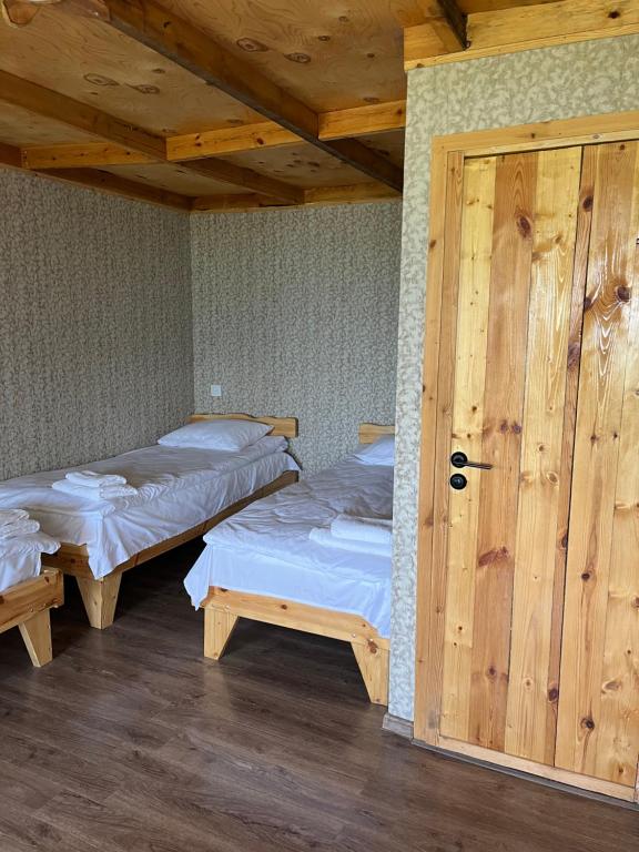 Postel nebo postele na pokoji v ubytování Forest INN