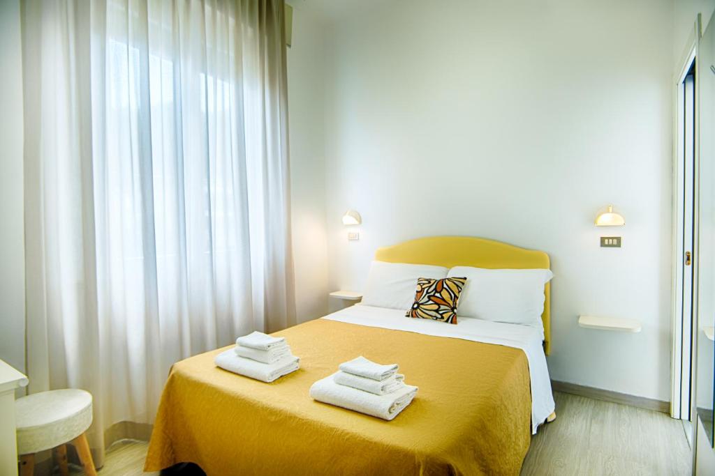 Postel nebo postele na pokoji v ubytování B&B Hotel Serenità