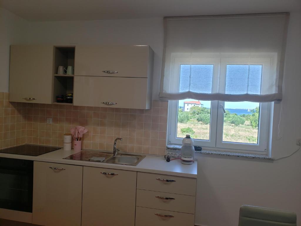 Kuchyňa alebo kuchynka v ubytovaní Apartmani Čiklić