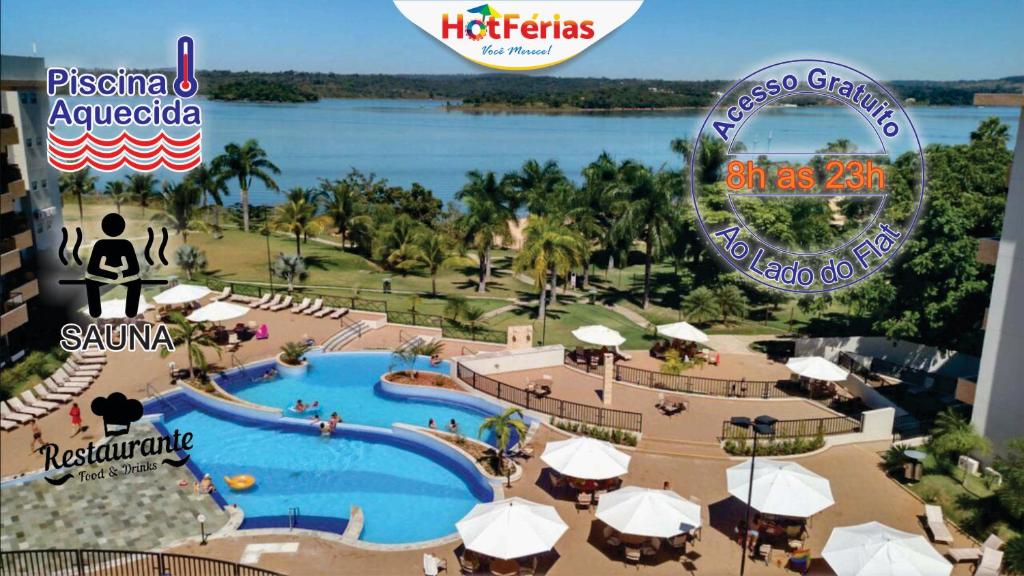 a view of a resort with a swimming pool at Náutico Flat Caldas Novas, próximo ao Náutico Praia Clube - HotFérias in Caldas Novas