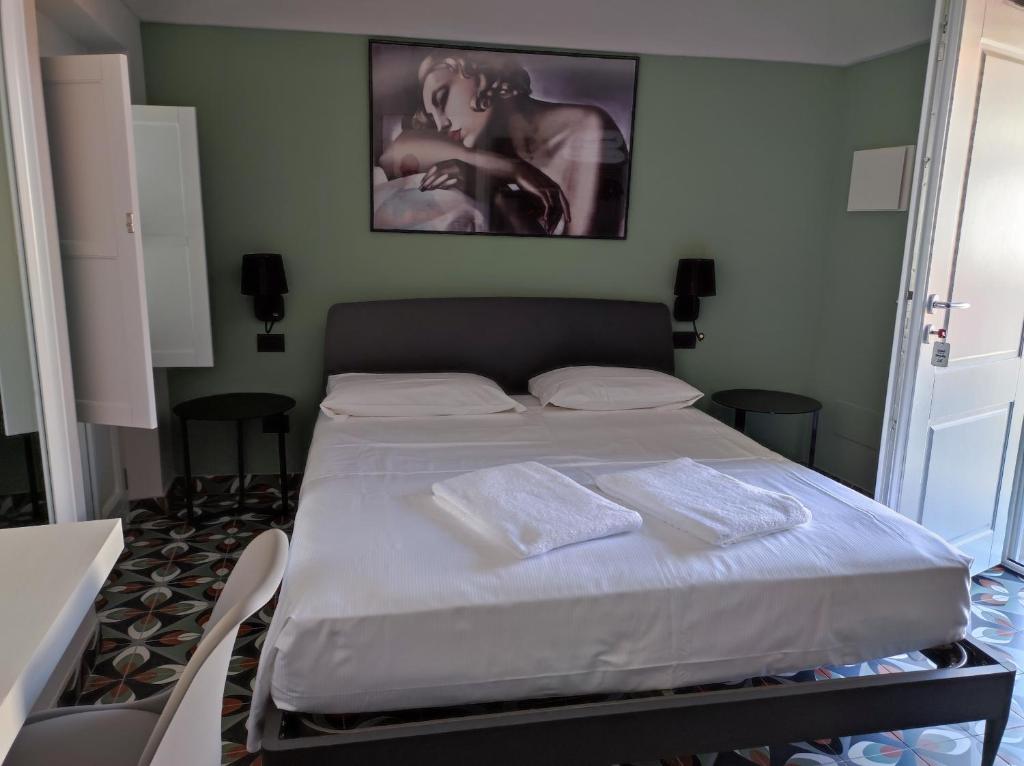 Postel nebo postele na pokoji v ubytování Hotel & Apartments " Perpoin "