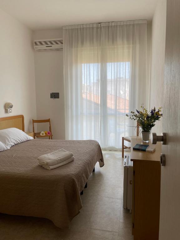 Postel nebo postele na pokoji v ubytování HOTEL LA PLAYA