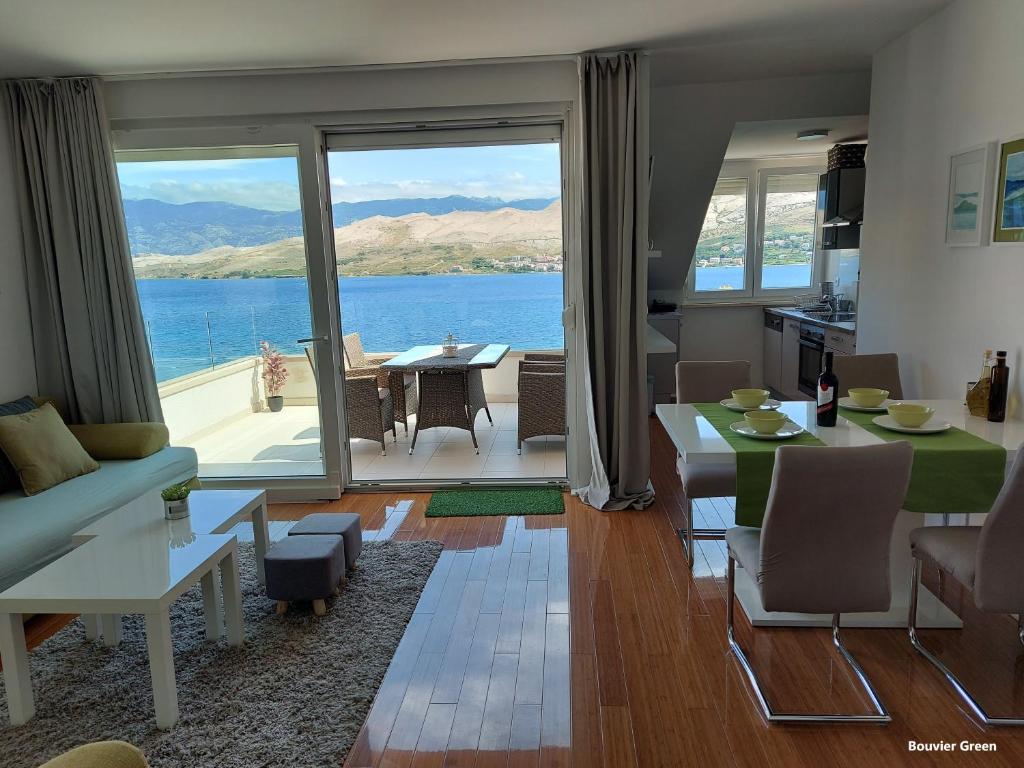 a living room with a view of the water at Apartments Bouvier in Pag