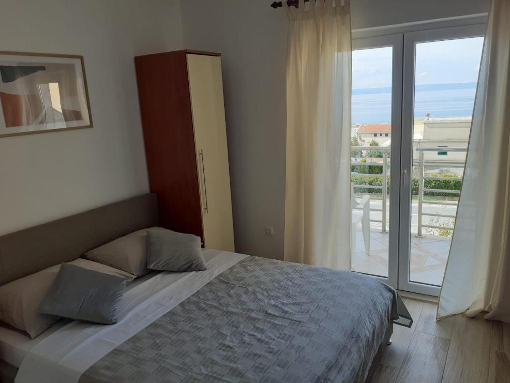 Una cama o camas en una habitación de Apartmani Rudan