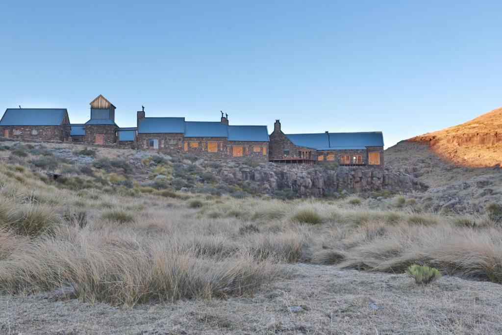 a building on top of a hill in a field at Tenahead Lodge & Spa in Rhodes