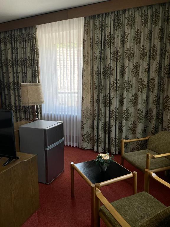 TV a/nebo společenská místnost v ubytování Hotel zum Markgrafen
