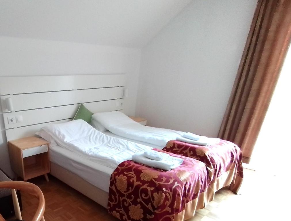 Postel nebo postele na pokoji v ubytování Pension MOYCHI