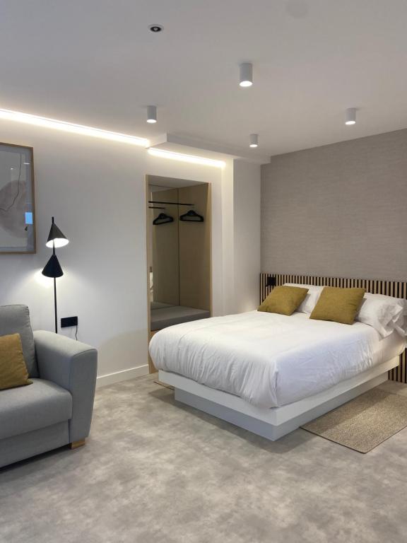 Postel nebo postele na pokoji v ubytování Apartamentos Forxán