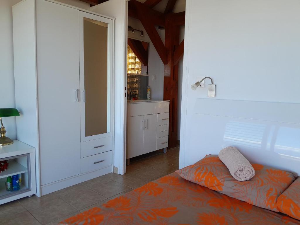 Postel nebo postele na pokoji v ubytování Bungalow Miwa