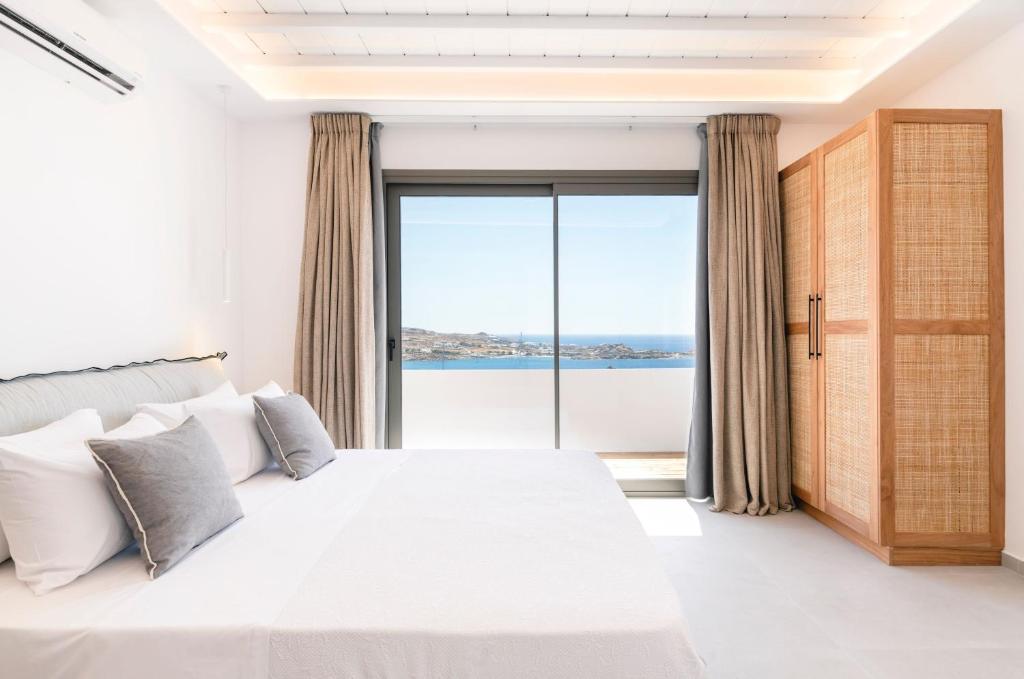 Łóżko lub łóżka w pokoju w obiekcie Villa Zen - MG Villas Mykonos