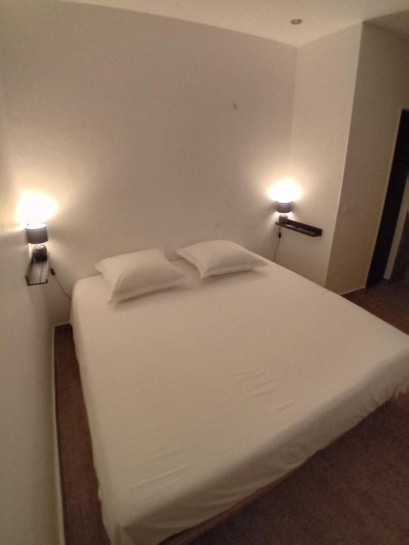 Postel nebo postele na pokoji v ubytování 11 Rue Vauban
