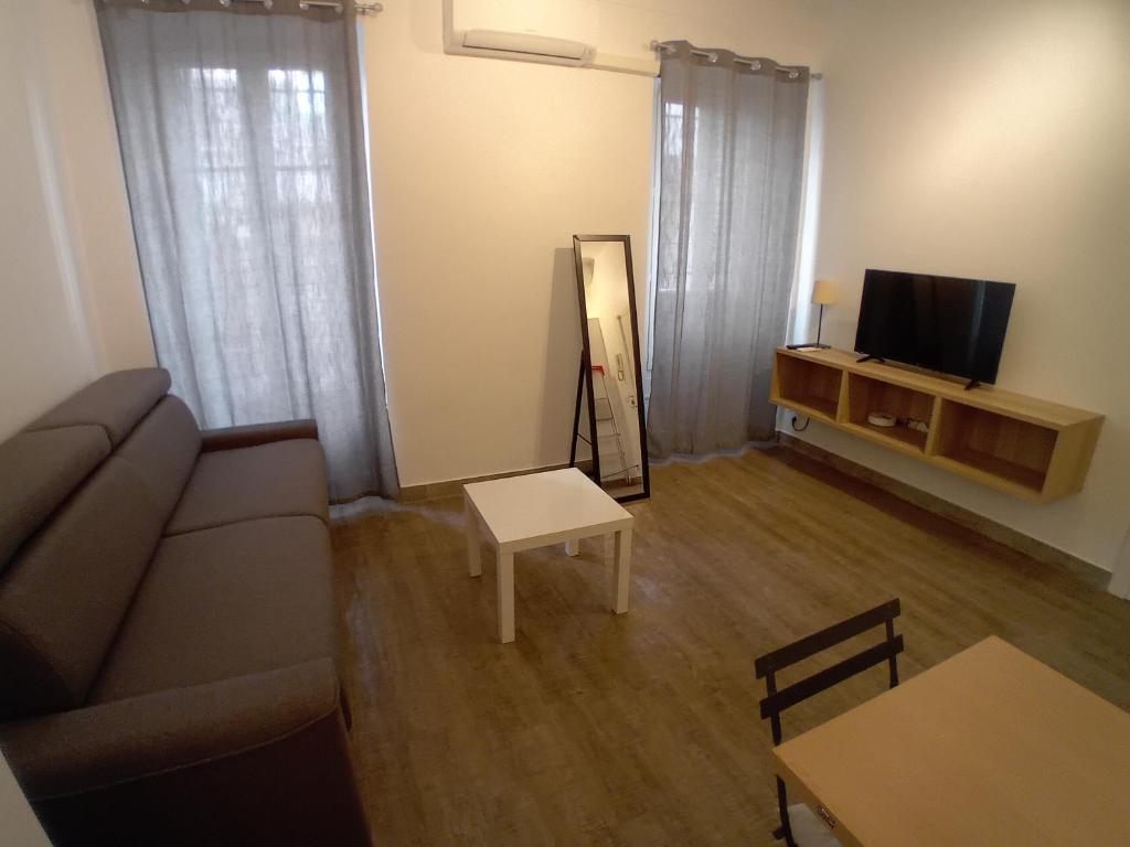 TV a/nebo společenská místnost v ubytování 11 Rue Vauban