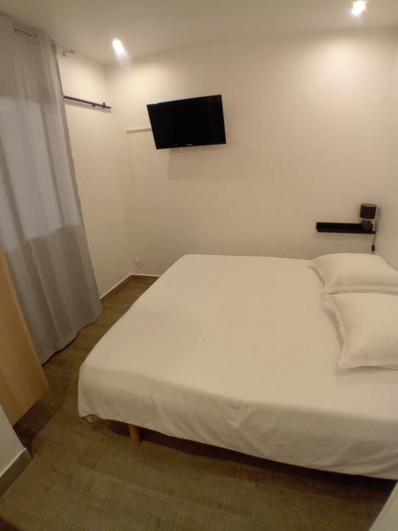 Postel nebo postele na pokoji v ubytování 11 Rue Vauban