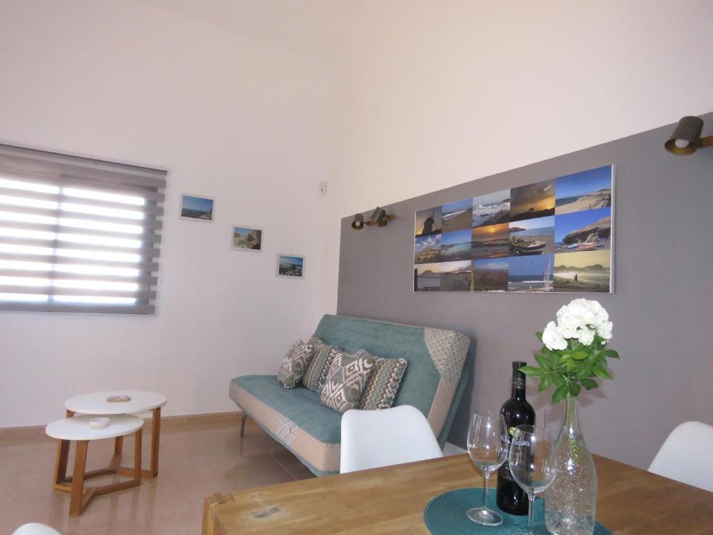 a living room with a couch and a table at Casa Mona in Corralejo